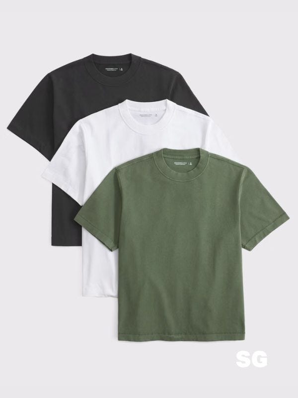 trio of cropped men's t-shirts in black, white, and green