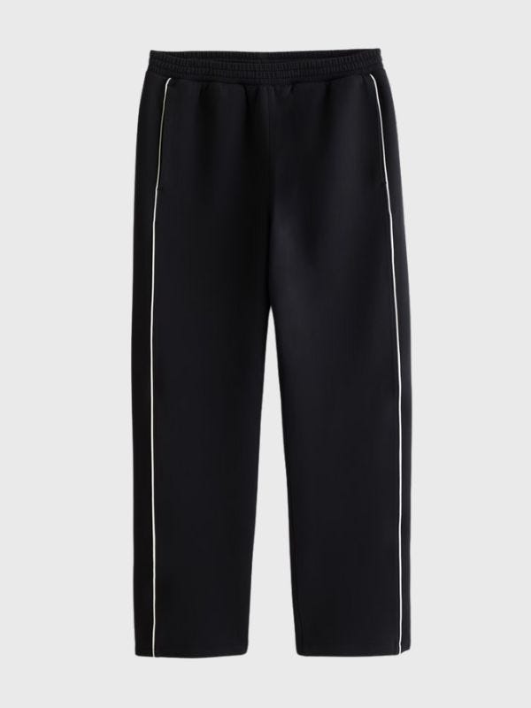 black track pants with a white stripe down the side