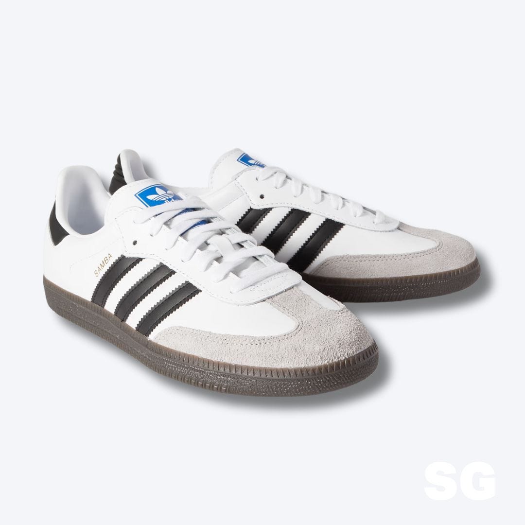 white adidas samba sneakers with black stripes