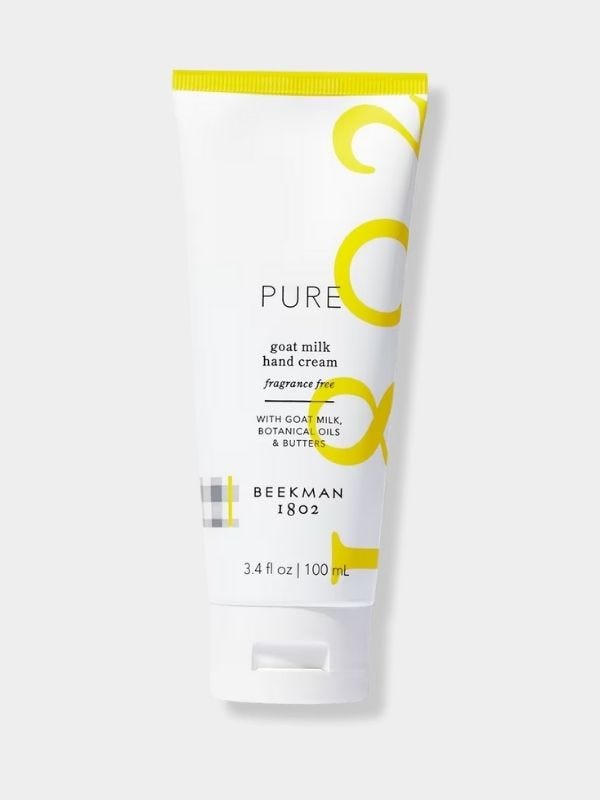 hand cream in a white and yellow bottle