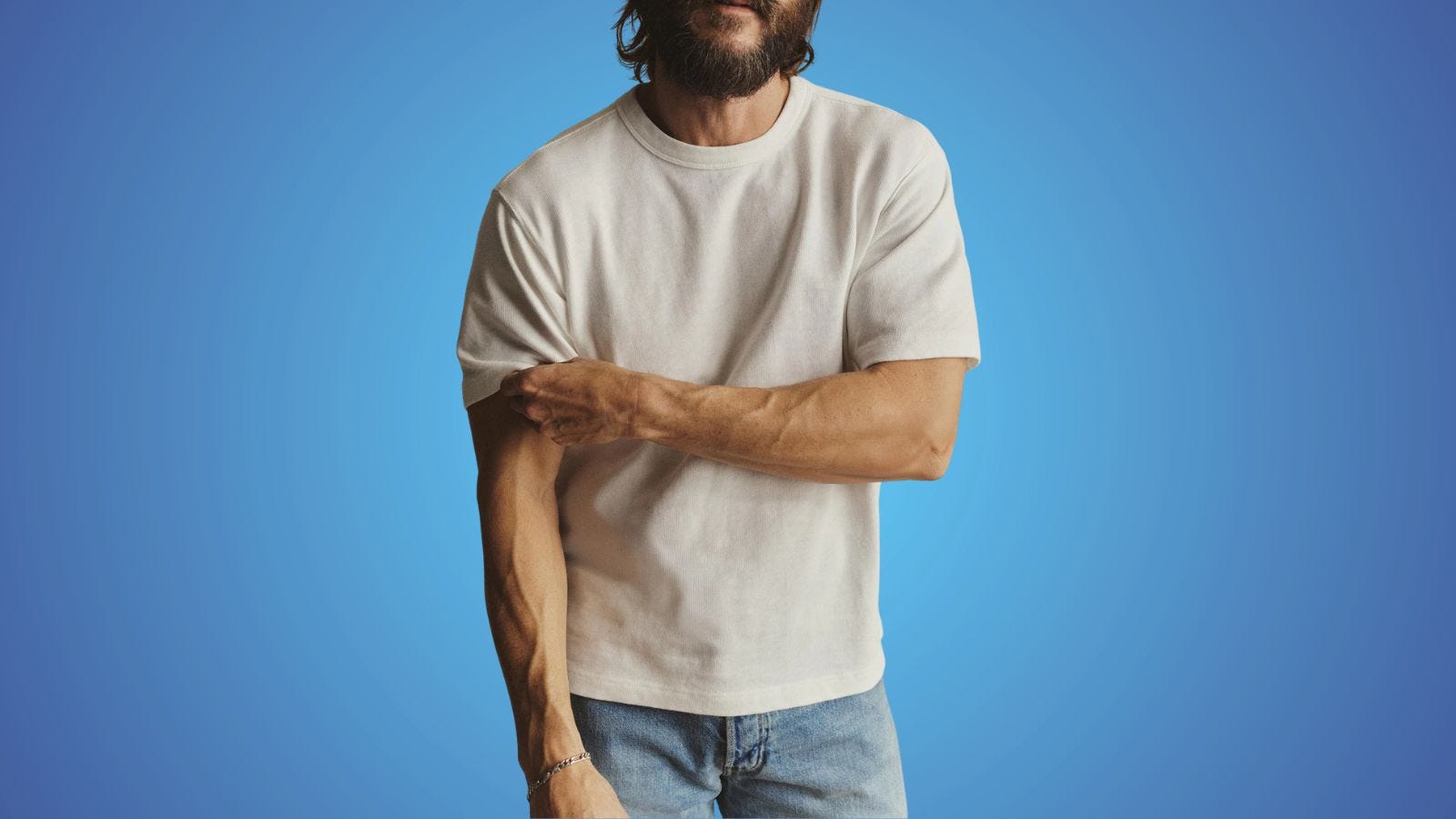 close-up of a man wearing a white heavyweight tee with light jeans