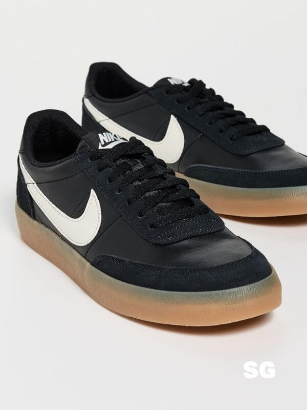 black nike sneakers with white swoosh