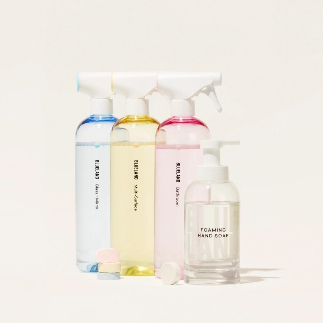 plastic spray bottles filled with cleaning fluids