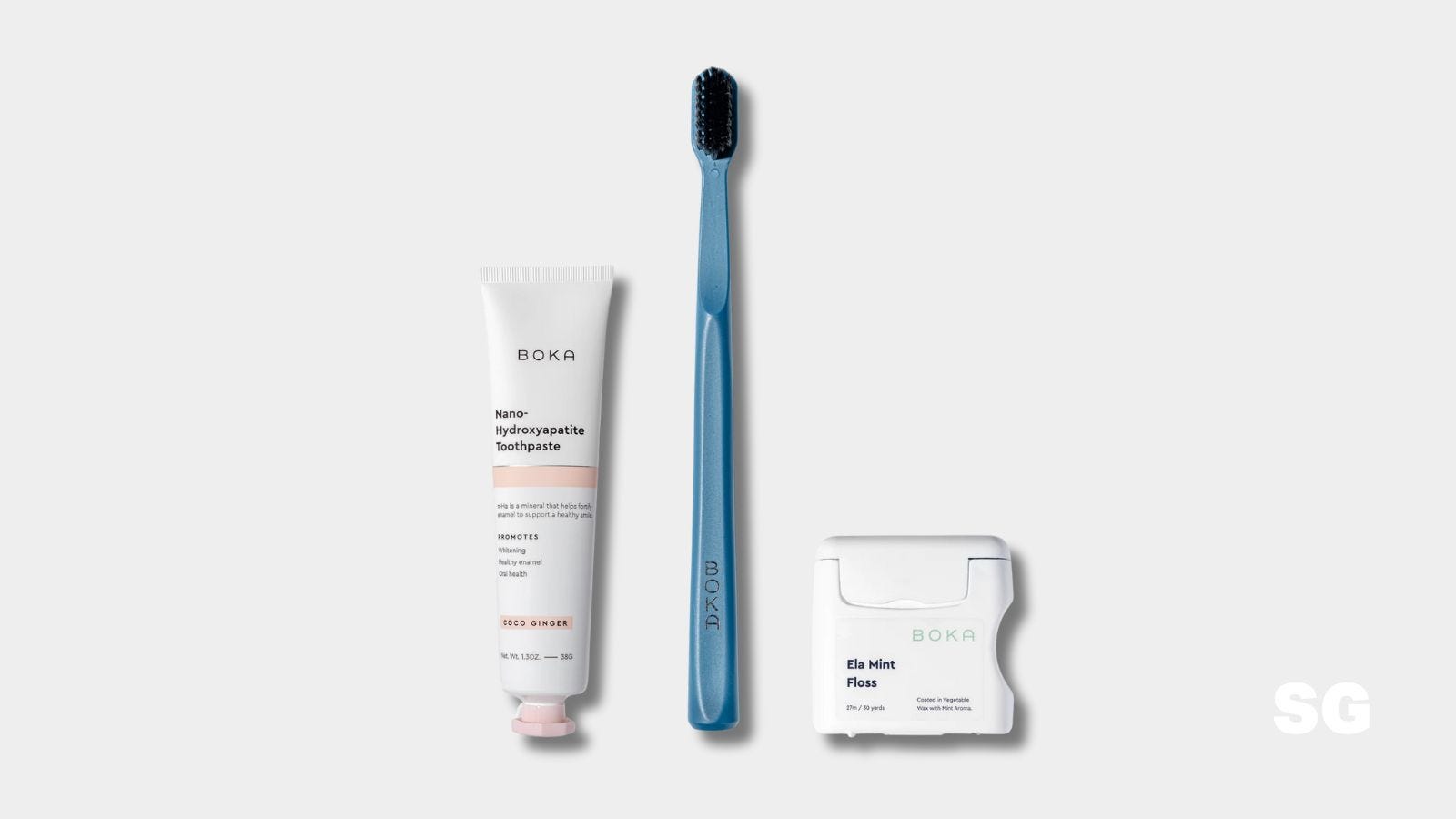 boka travel toothbrush in blue with toothpaste and floss