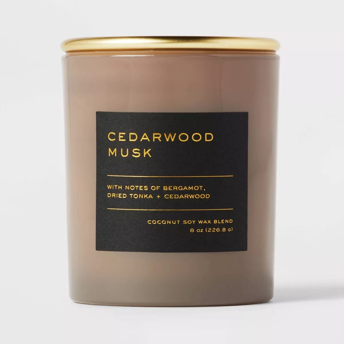 round candle, label reads: cedarwood musk