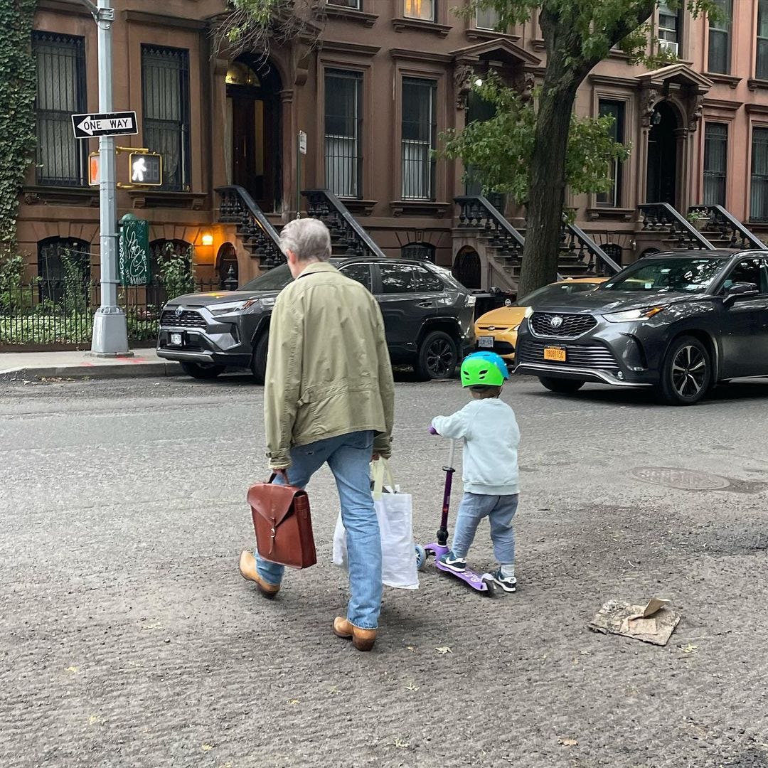 man and child crossing the street in nyc