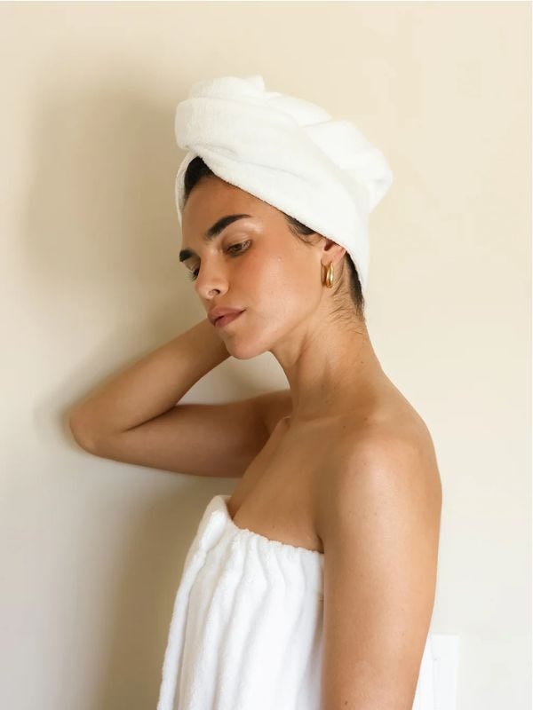 woman wearing a towel wrapped around her hair