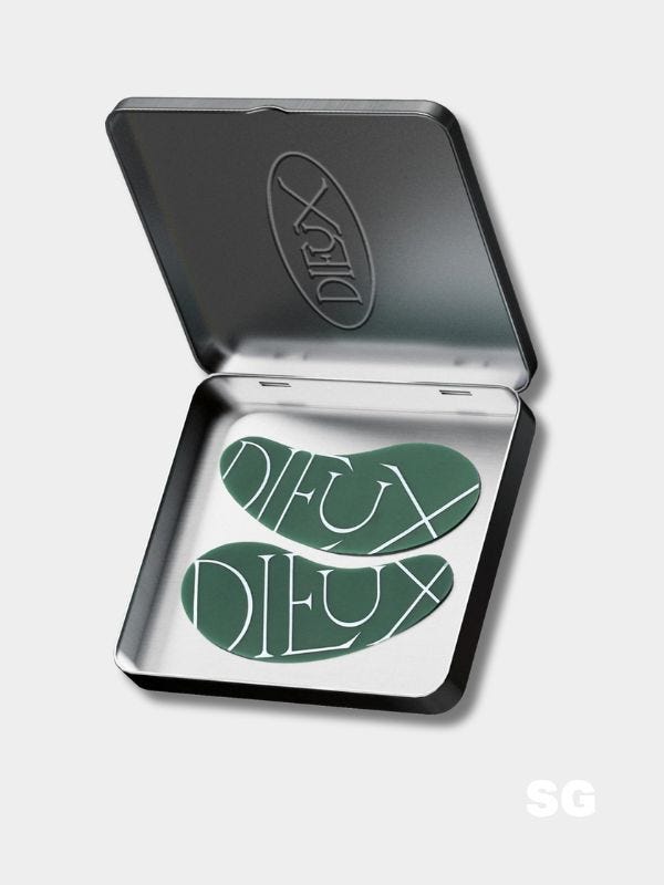 open tin with two green silicone undereye masks