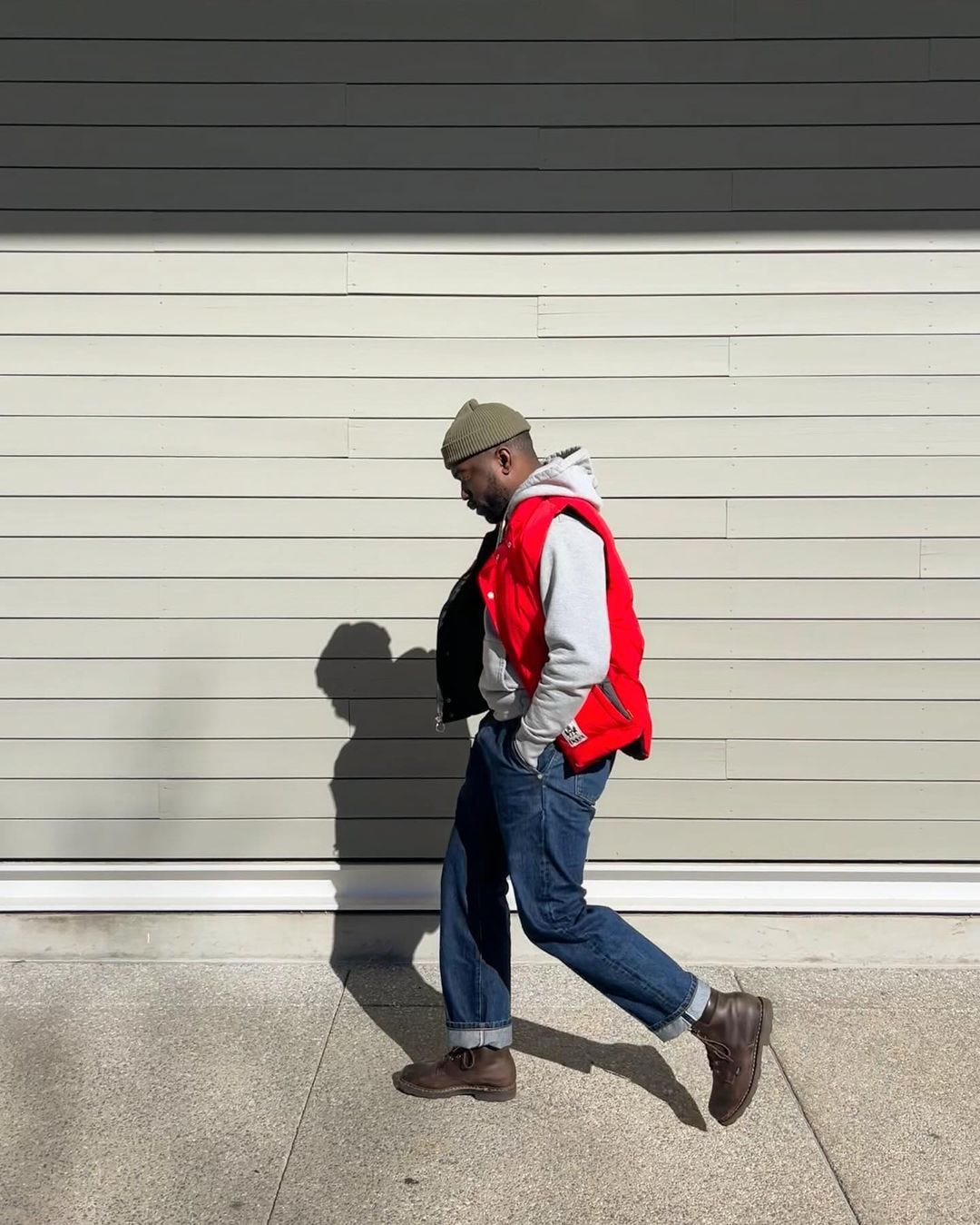 men's outfits with jeans and a puffer vest