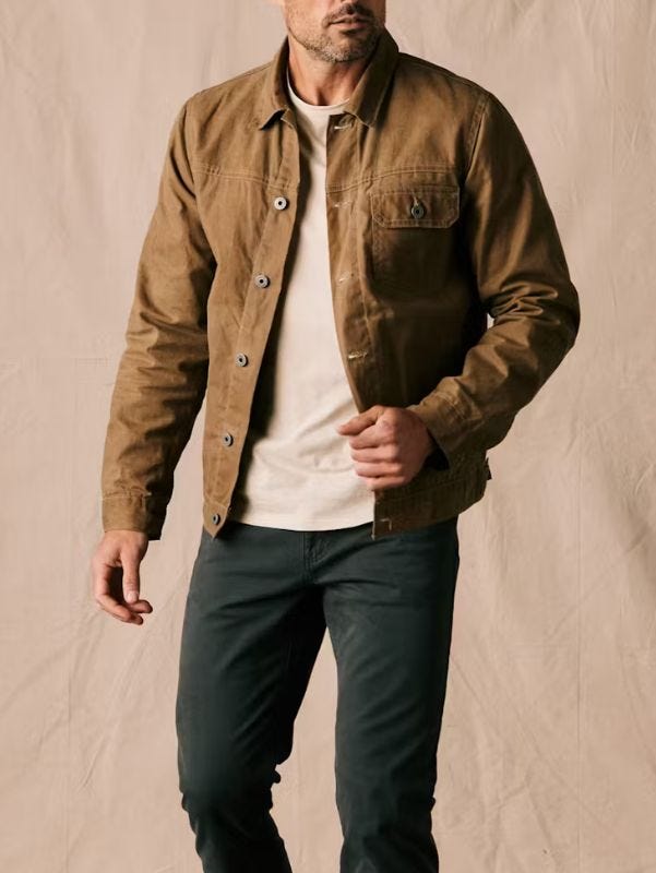 close-up of a man wearing flint and tinder's Flannel-Lined Waxed Trucker Jacket
