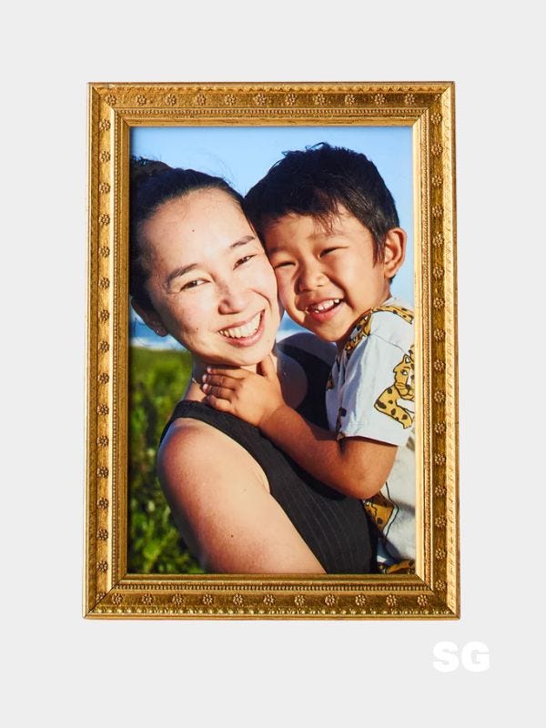 gold frame of a mom and son