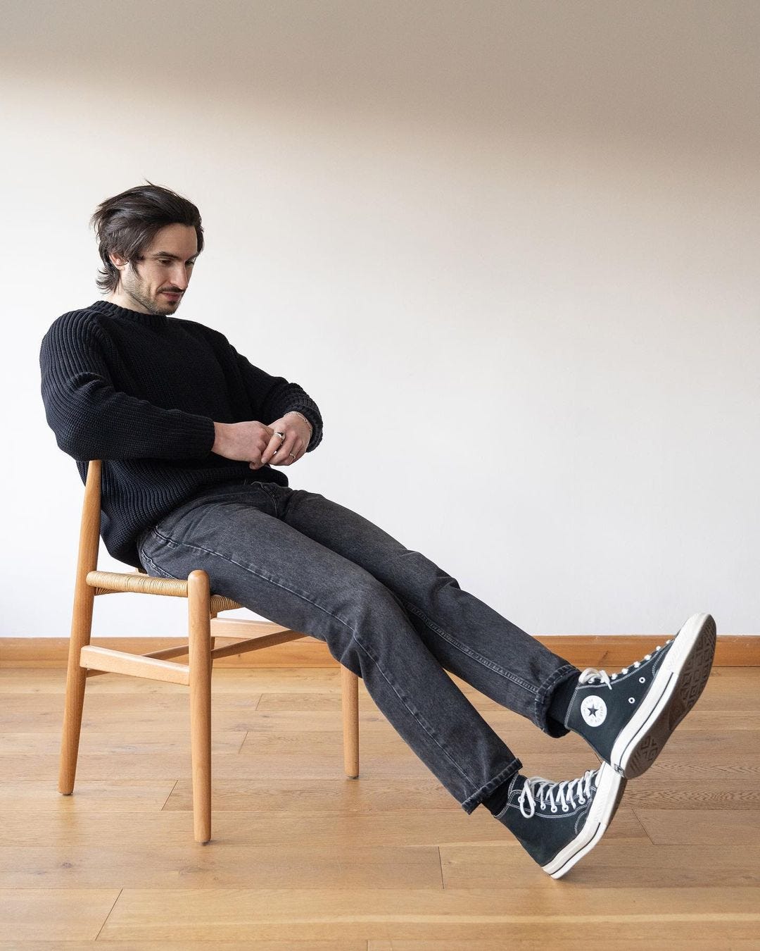 men's black jeans outfit with black sweater