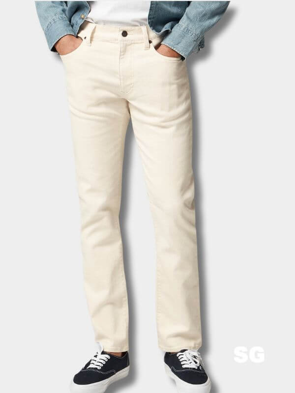 man from the waist down wearing white jeans
