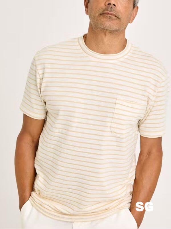 close-up of a man wearing a yellow and white striped t-shirt
