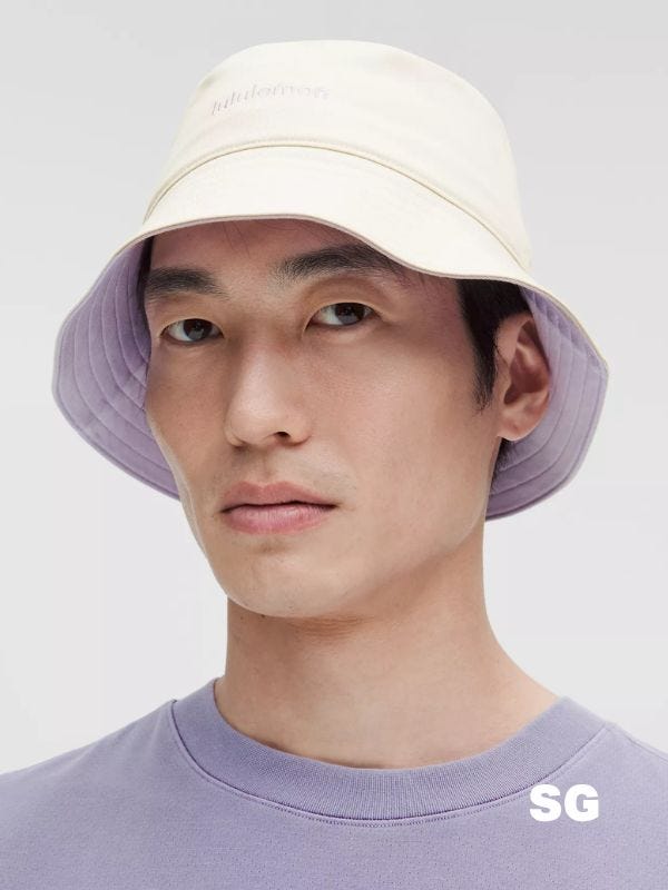man wearing a cream-colored bucket hat