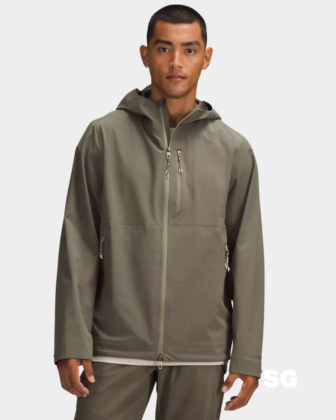 stylish man wearing a green windbreaker