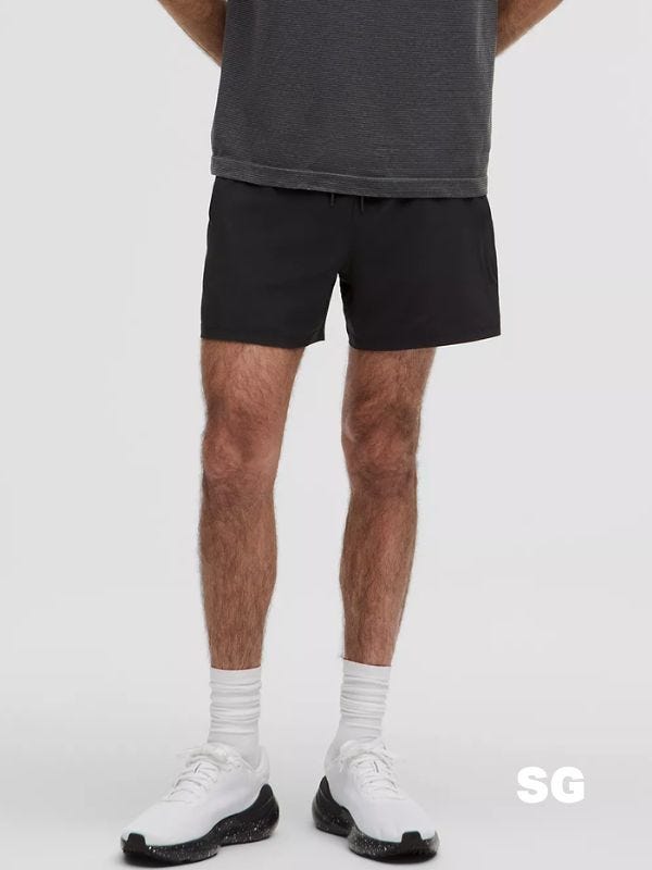 man wearing black hybrid shorts