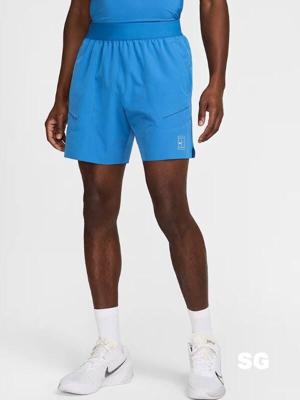 man from the waist down wearing blue nike tennis shorts