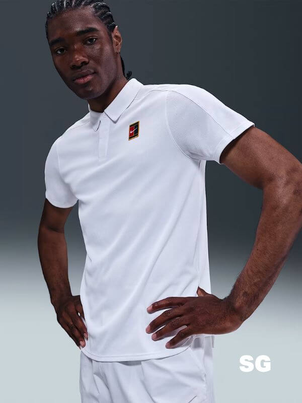 man wearing a white nike tennis polo shirt