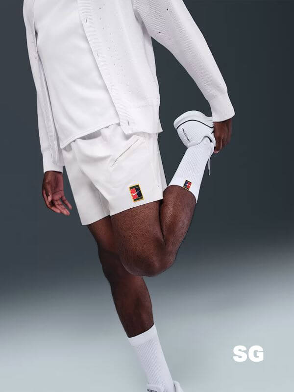 man wearing nike tennis shorts in white