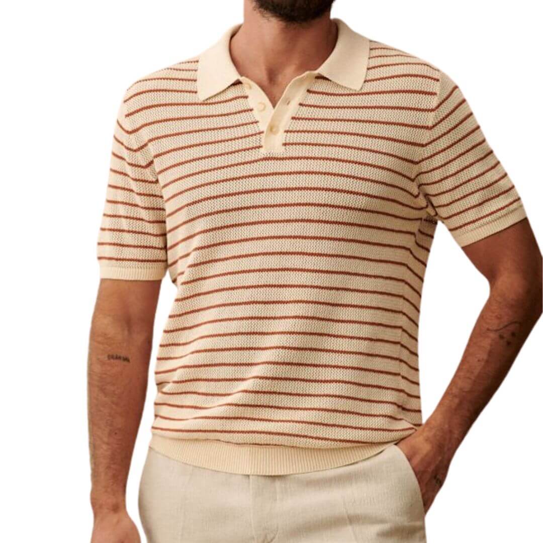 close-up of a man wearing a red and cream-striped knit polo shirt