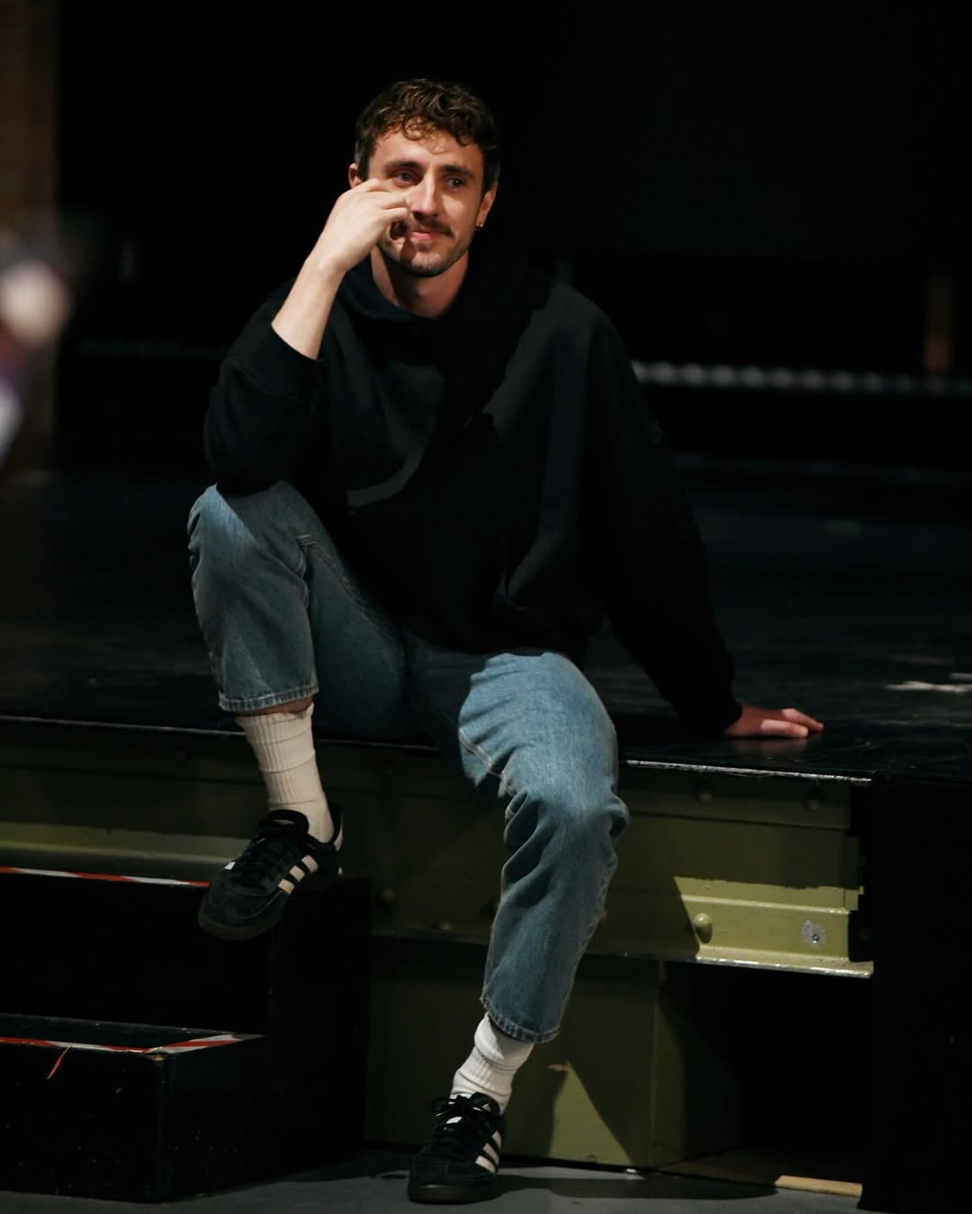 actor Paul Mescal wearing Adidas sneakers on the set of NBC's Saturday Night Live