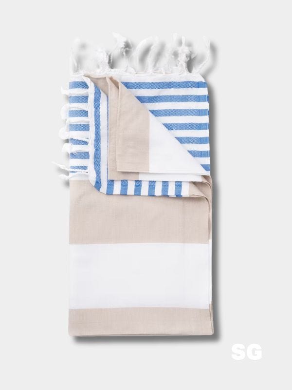 blue and white striped turkish beach towel