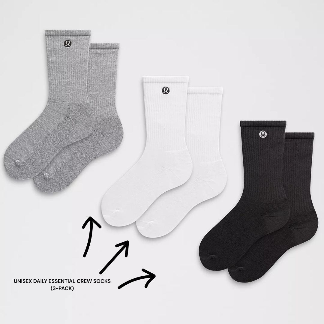 three pairs of lululemon daily essential crew socks in grey, white, and black