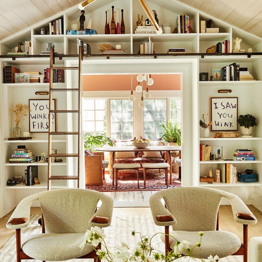 vaulted living room with built-in bookshelves