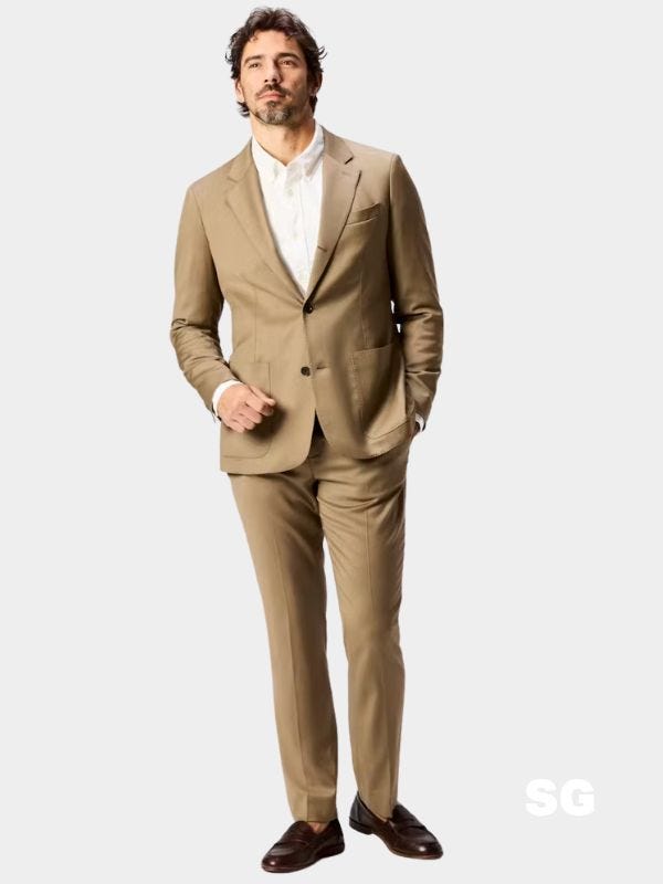 stylish man wearing a lightweight summer suit in tan