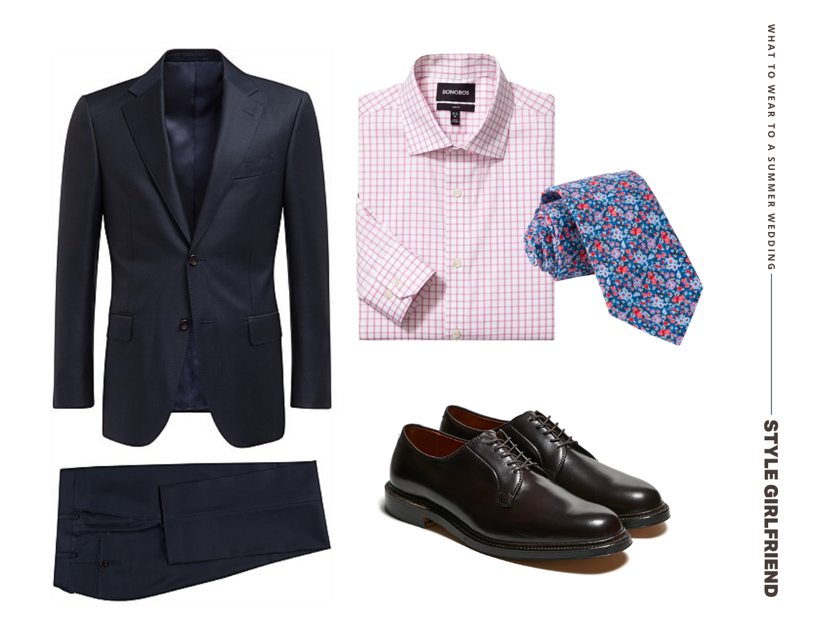 flat lay of a navy suit with a pink checked shirt and floral tie and black dress shoes. text on-screen reads: what to wear to a summer wedding